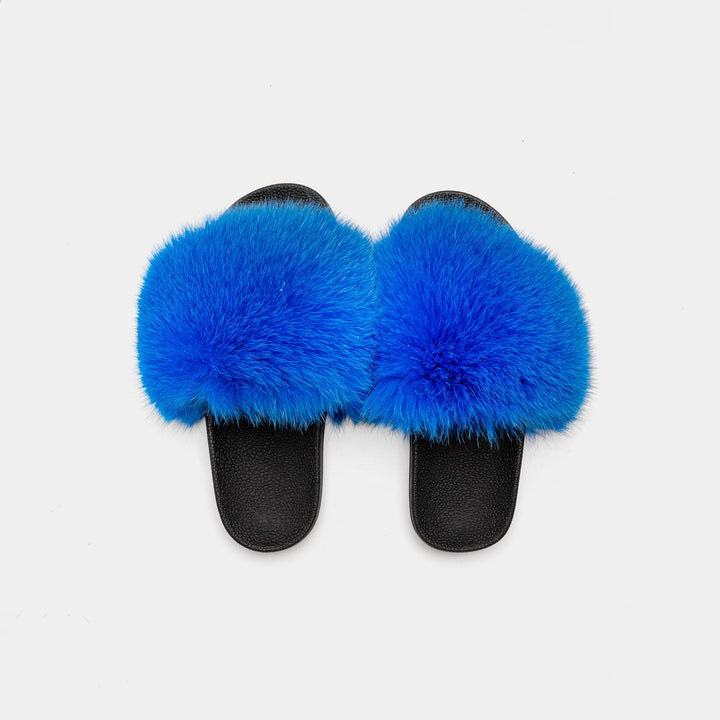 Pantofole donna blu in pelliccia, calzature eleganti e confortevoli, ideali per momenti di relax in casa.