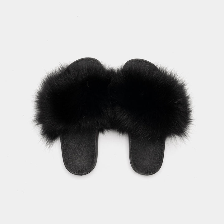Pantofole nere da donna di lusso con vera pelliccia di volpe, suola antiscivolo. Calore e moda per l'inverno in casa.