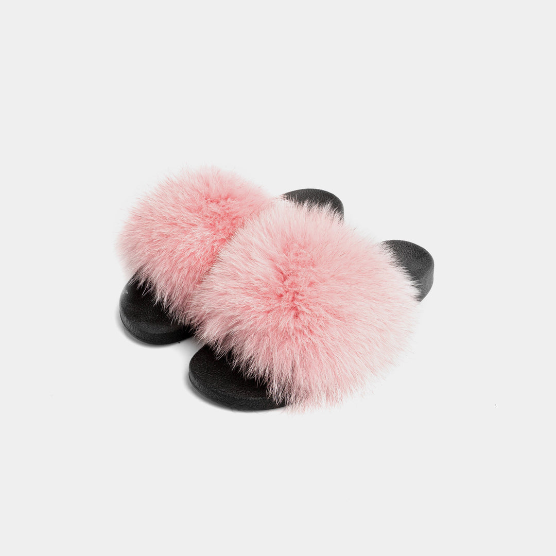 Pantofole da donna rosa in pelliccia di volpe, morbide e lussuose per il massimo comfort a casa.