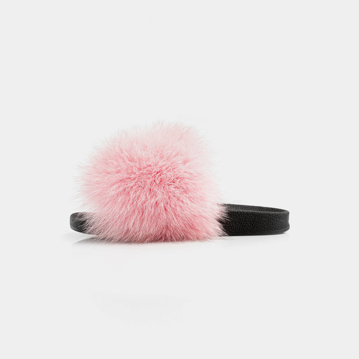 Morbide pantofole rosa da donna in pelliccia di volpe, perfette per momenti di relax e calore a casa.