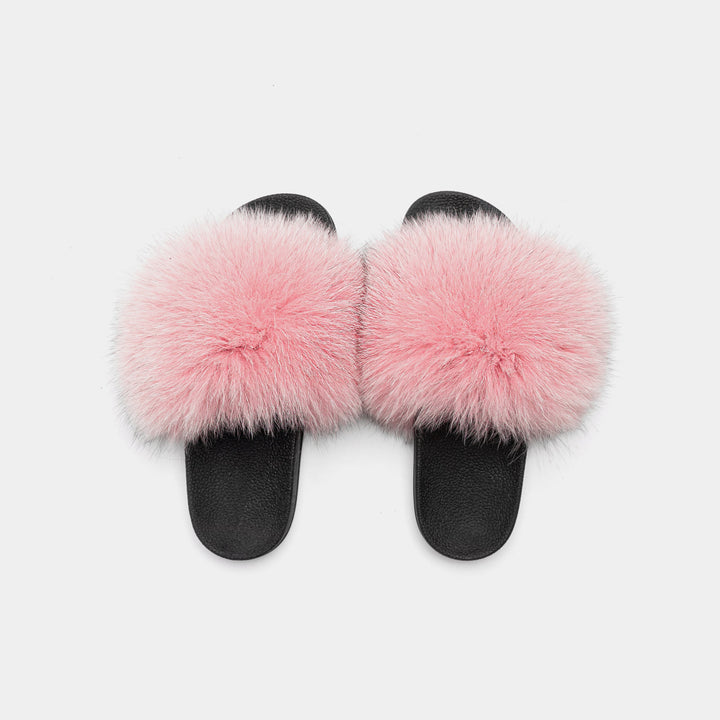 Eleganti pantofole rosa in soffice pelliccia di volpe per donna, un tocco di lusso e comfort per la casa.