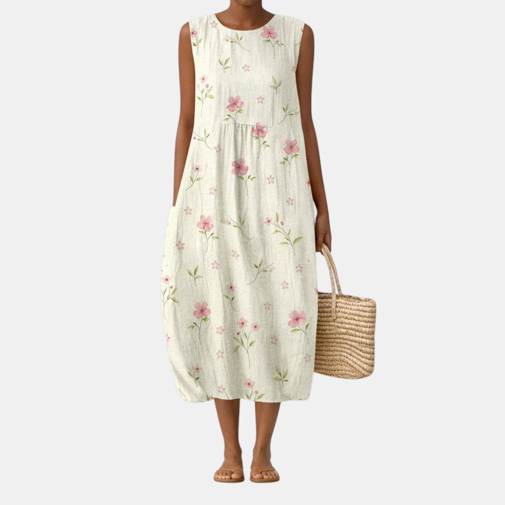 Vestito midi donna floreale estivo, elegante e casual. Abito senza maniche, ideale per ogni occasione primaverile.
