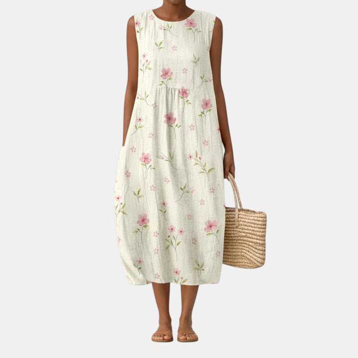 Vestito midi donna floreale estivo, elegante e casual. Abito senza maniche, ideale per ogni occasione primaverile.