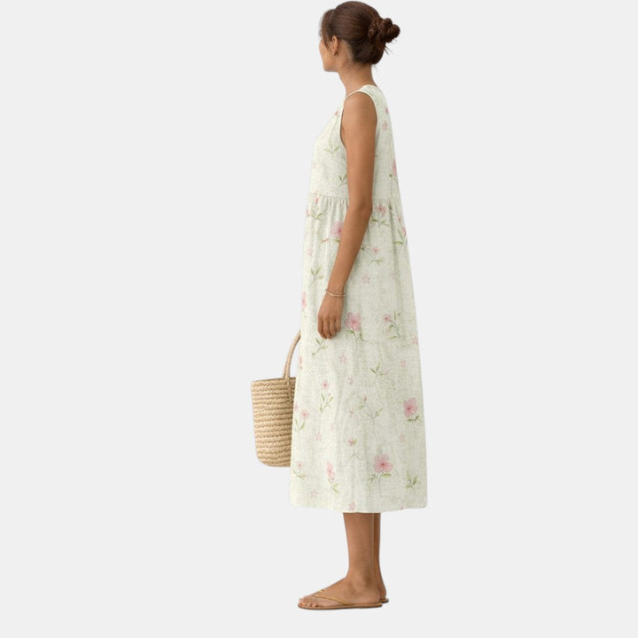 Elegante abito midi donna floreale senza maniche, perfetto per look estivi e primaverili versatili. Abbigliamento comodo.