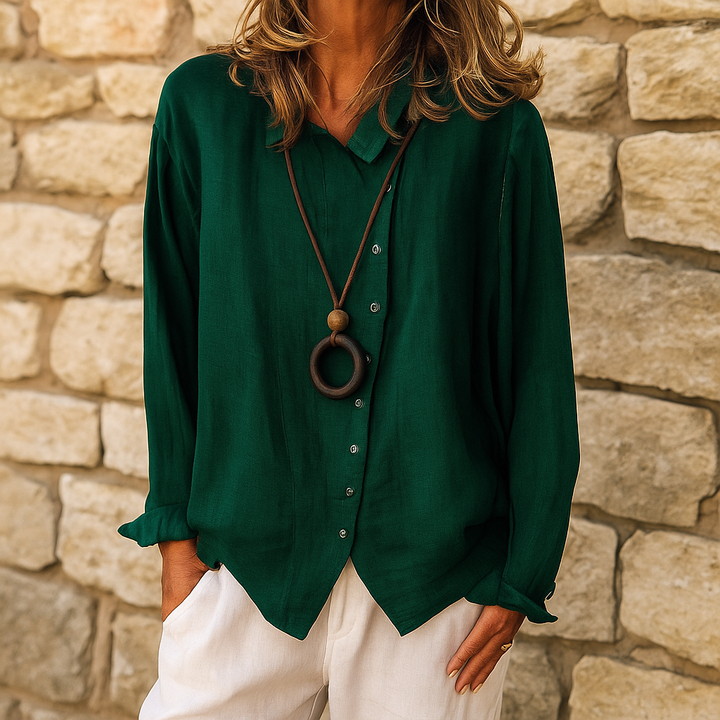 Camicetta donna moda con scollo a V e maniche lunghe. Blusa versatile ed elegante per un look contemporaneo.