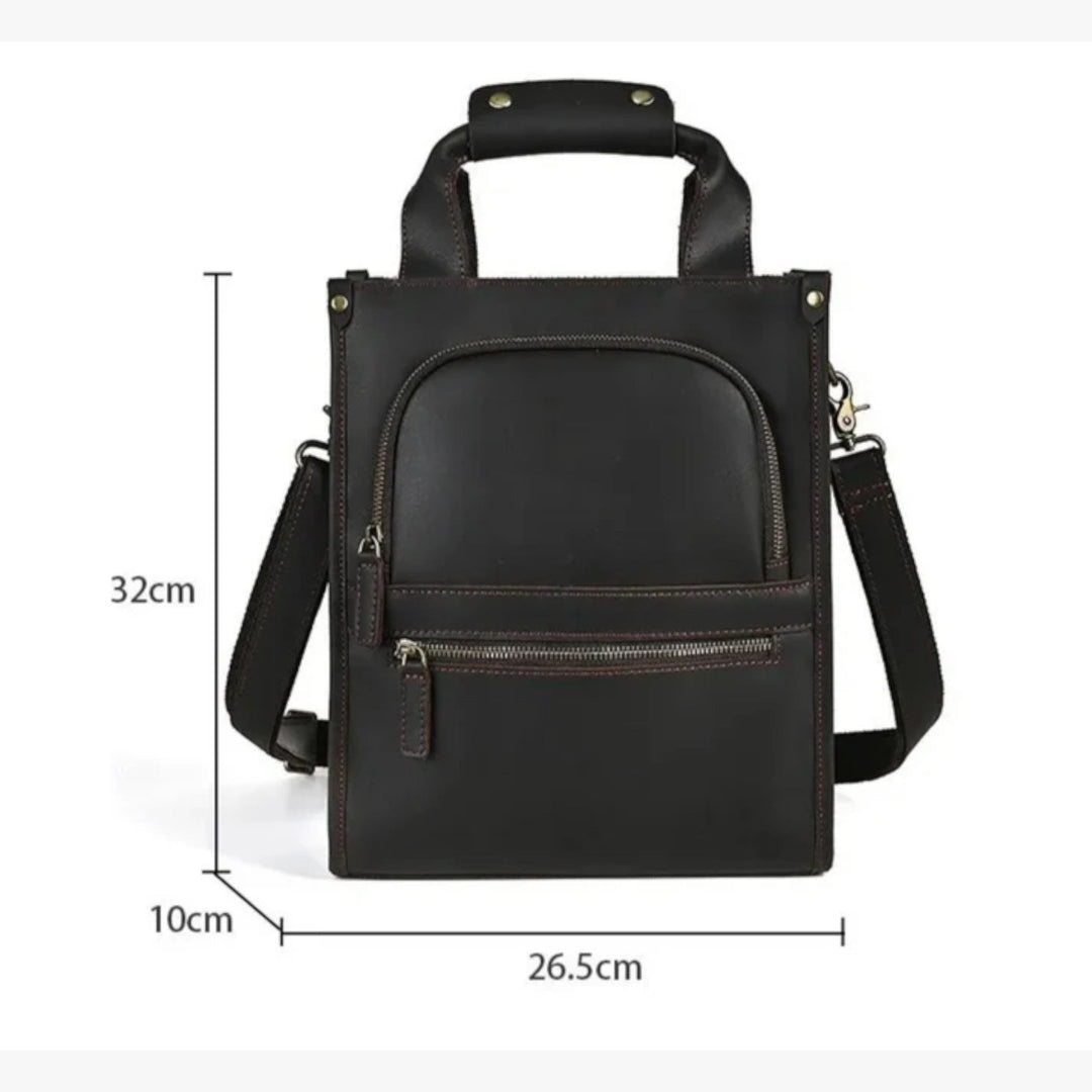 Dettaglio patta e chiusura borsa portadocumenti unisex marrone, accessorio elegante per l'ufficio.