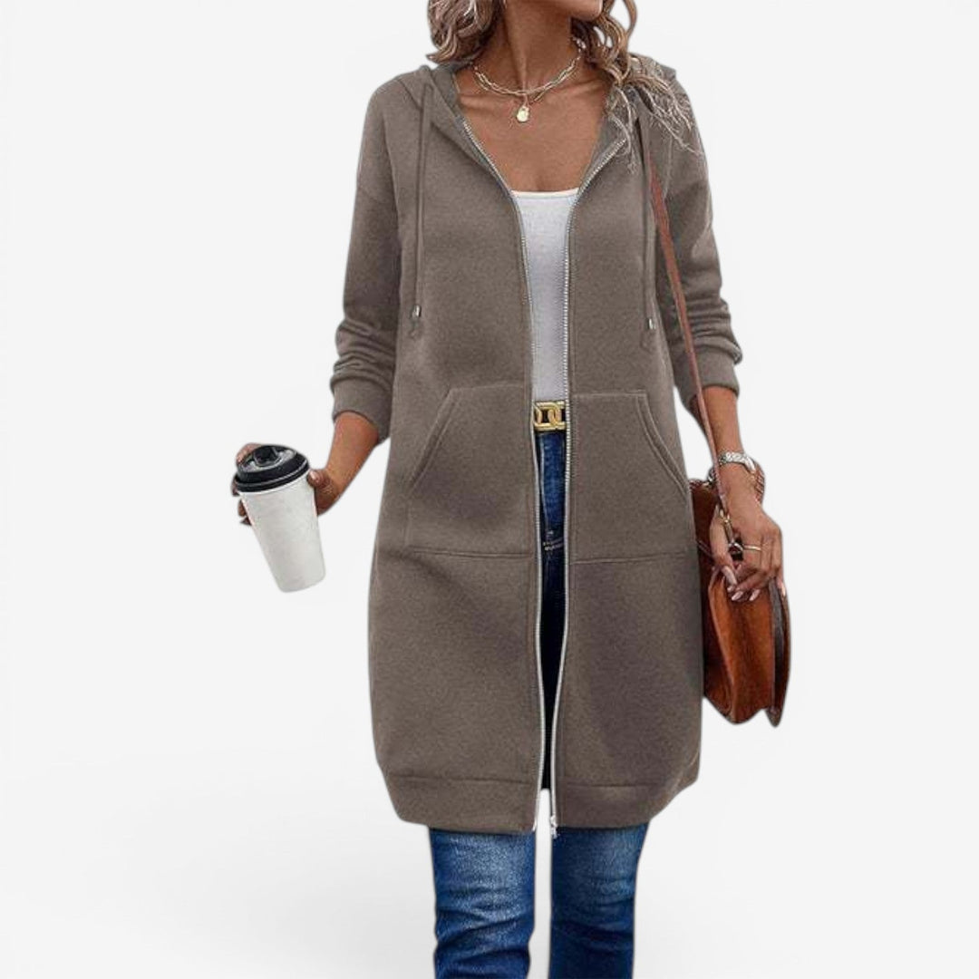 Felpa donna con cappuccio, zip e taglio lungo per outfit casual moda autunno inverno.