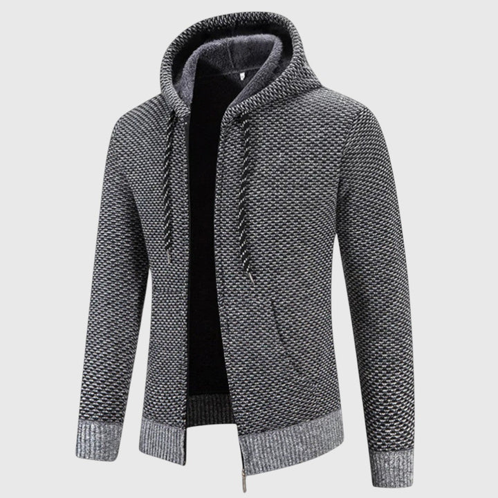 Felpa con cappuccio e zip integrale per uomo. Design confortevole, perfetta per strati autunnali e sportivi.