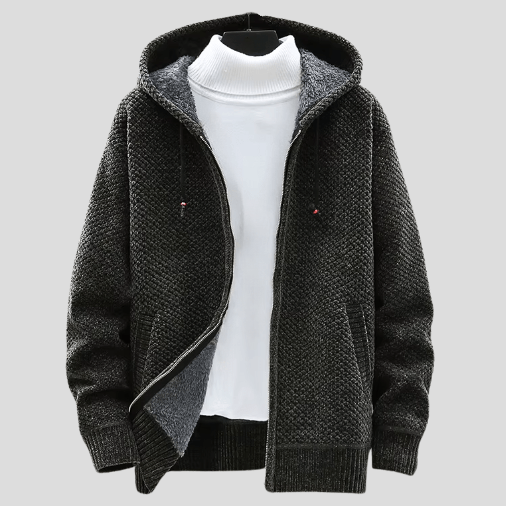 Dettaglio texture felpa uomo con cappuccio. Tessuto caldo e morbido, comfort ideale per l'inverno.