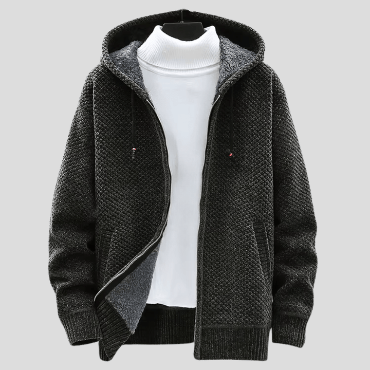Dettaglio texture felpa uomo con cappuccio. Tessuto caldo e morbido, comfort ideale per l'inverno.