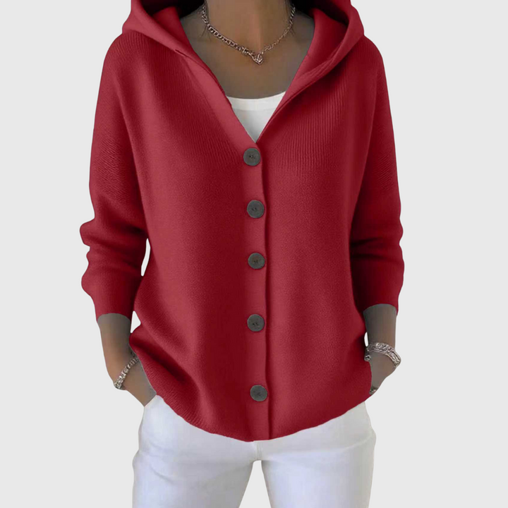 Cardigan lungo donna con cappuccio e bottoni, un capo comodo che unisce stile e versatilità autunnale.