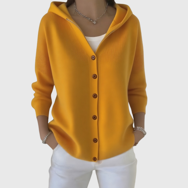 Cardigan donna lungo e versatile con cappuccio e bottoni frontali, ideale per l'outfit di tutti i giorni.
