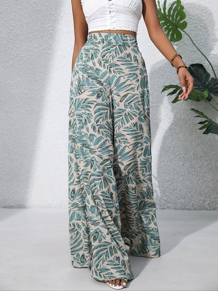 Pantaloni palazzo da donna a vita alta con stampa floreale, eleganti e fluidi per l'estate.