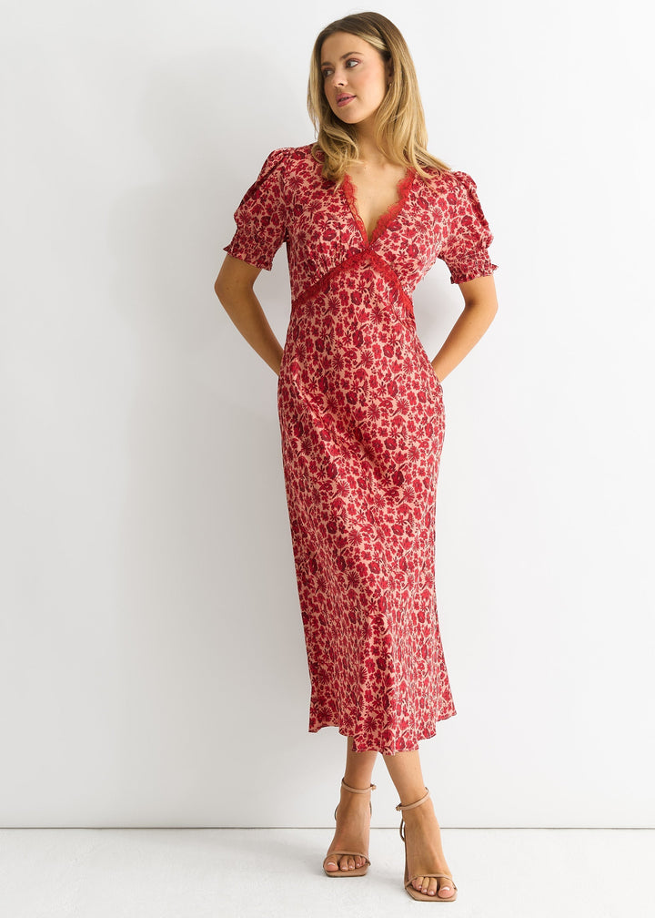 Abito rosso midi da donna con scollo a V e pizzo floreale, perfetto per cerimonia o look casual chic.
