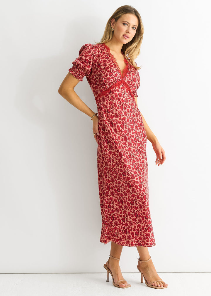 Elegante abito donna midi con rifiniture in pizzo floreale e profondo scollo a V. Ideale per eventi speciali.