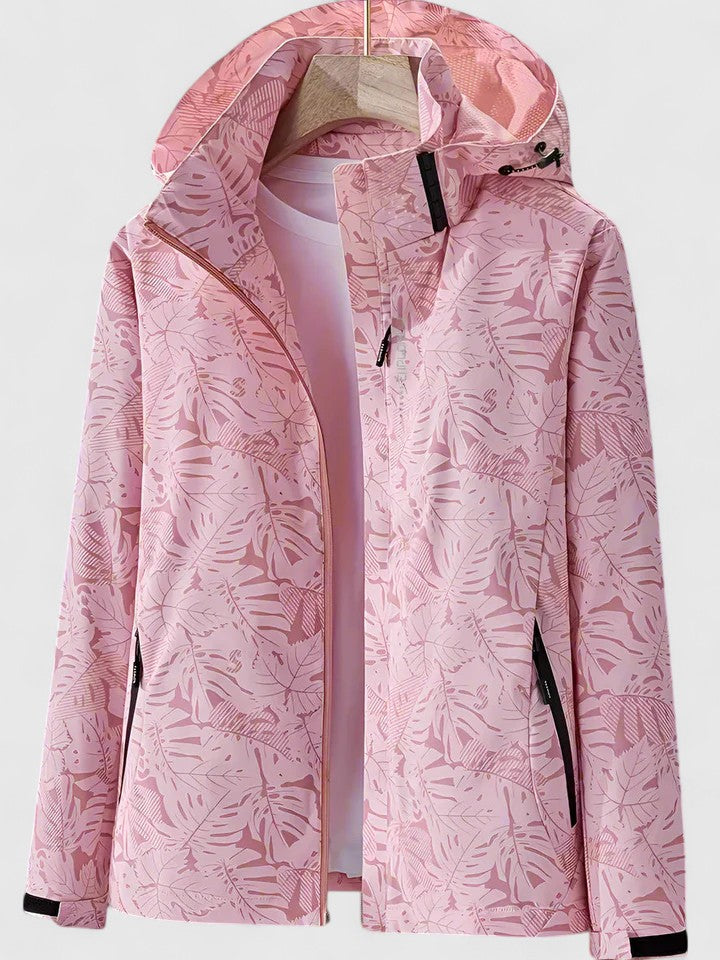 Giacca donna alla moda con cappuccio e vivace fantasia tropicale, ideale come outerwear casual primavera/autunno.