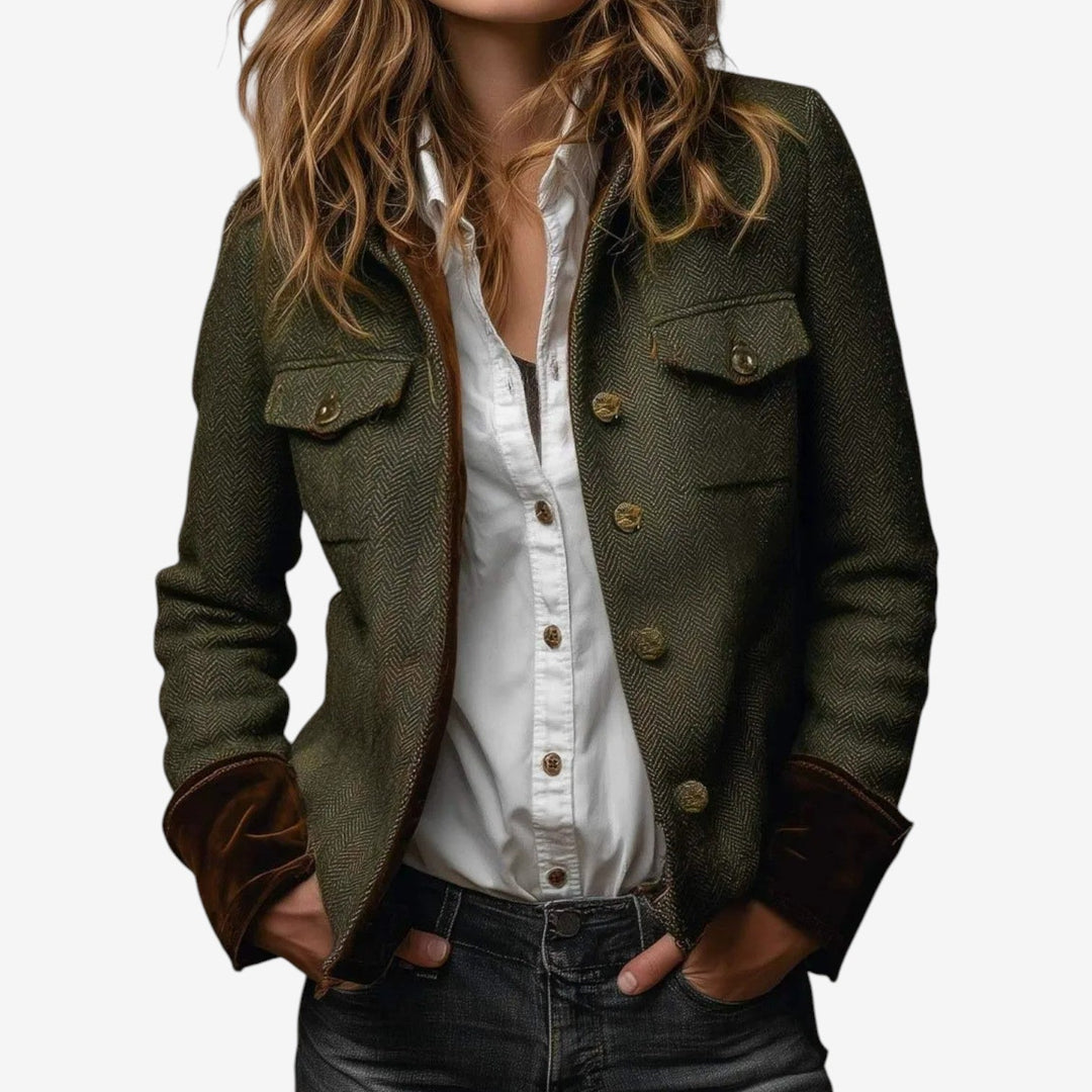 Giacca donna strutturata verde scuro con motivo a spina di pesce. Capospalla elegante per moda femminile, stile vintage.