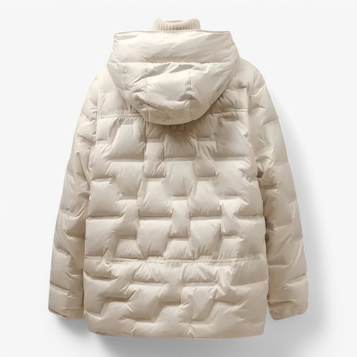 Elegante giacca invernale da donna con cappuccio. Design trapuntato, calda e versatile per la moda outerwear.