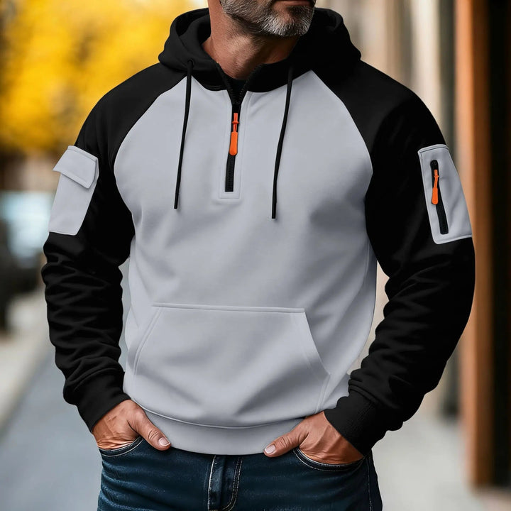 Giacca uomo sportiva con cappuccio e zip frontale, stile urbano moderno. Ideale per autunno e inverno.