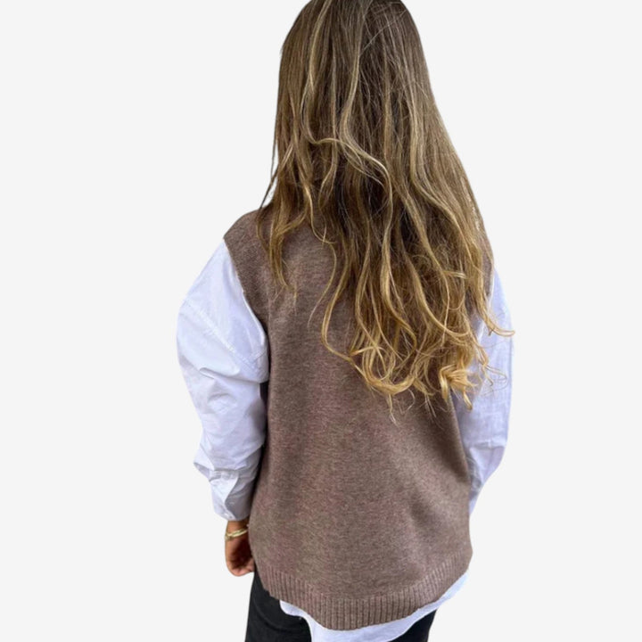 Elegante gilet donna oversize in maglia, con profondo scollo a V per un look moda casual-chic.