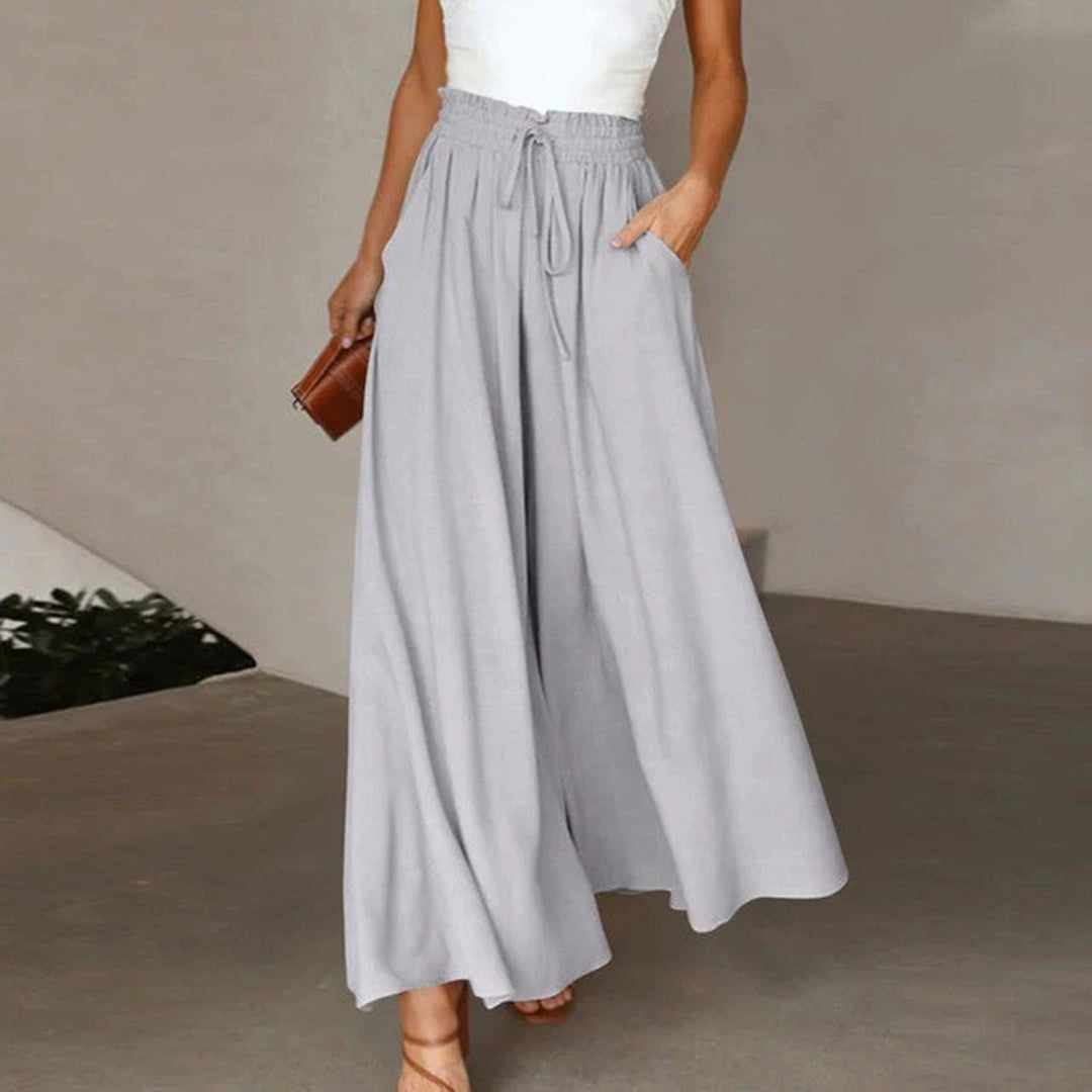 Pantaloni donna palazzo a gamba larga con coulisse in vita, fluidi e confortevoli per ogni occasione.
