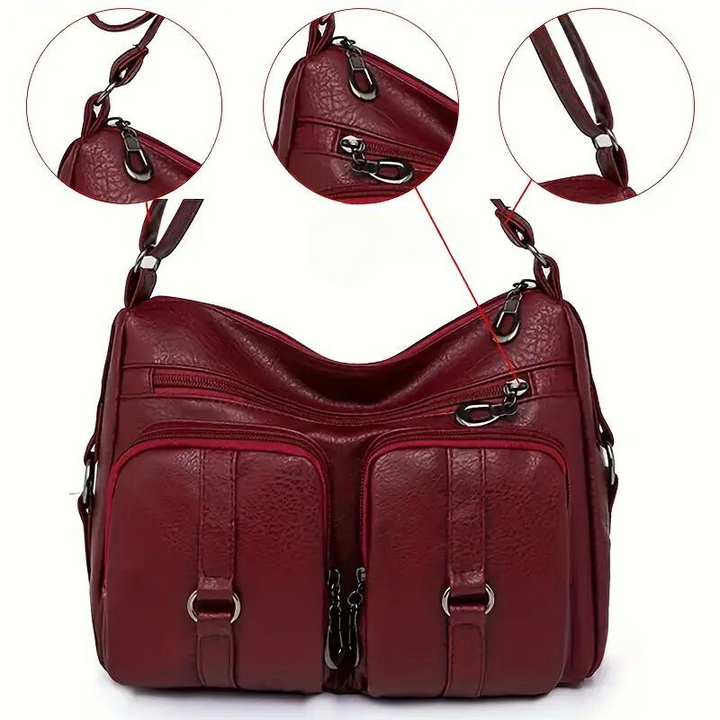 Dettaglio cerniere e hardware della borsa a tracolla multitasche, qualità per accessorio moda e borsa quotidiana.