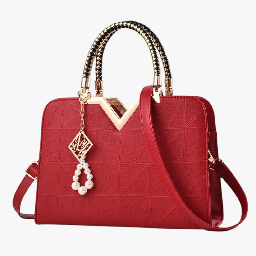 Borsa a mano donna, stile elegante e manici con decori gioiello. Un must-have della moda.
