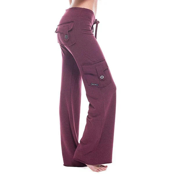 Pantaloni cargo donna con ampie tasche laterali funzionali, vita elastica e design svasato. Perfetti per ogni giorno.