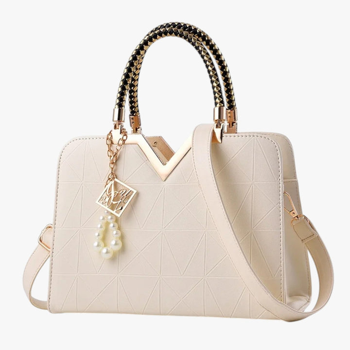 Borsa elegante da donna con manici gioiello, ideale per un look raffinato e di tendenza.