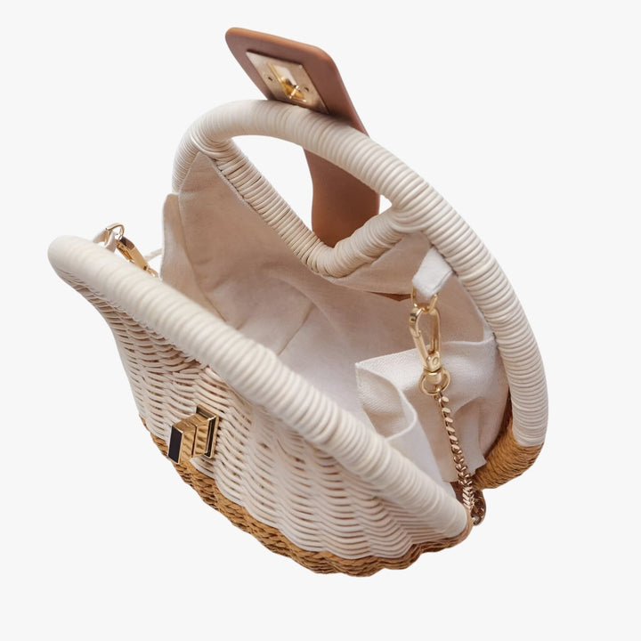 Borsa estiva rotonda da donna in paglia naturale, con pratica tracolla, per un tocco di moda.