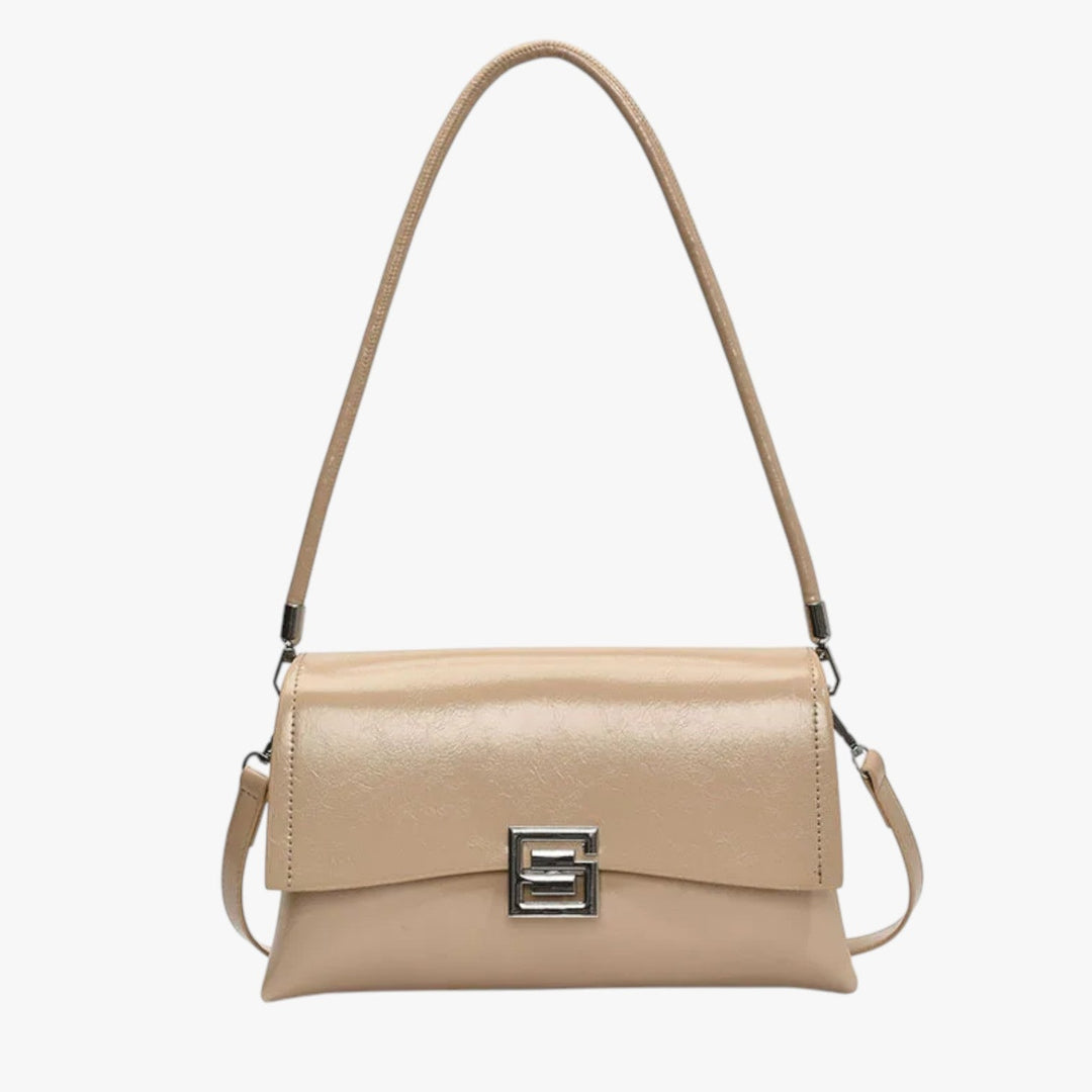 Elegante borsa a spalla rosa con tracolla regolabile, accessorio moda donna per un look sofisticato e moderno.