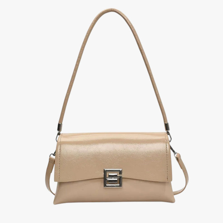 Elegante borsa a spalla rosa con tracolla regolabile, accessorio moda donna per un look sofisticato e moderno.