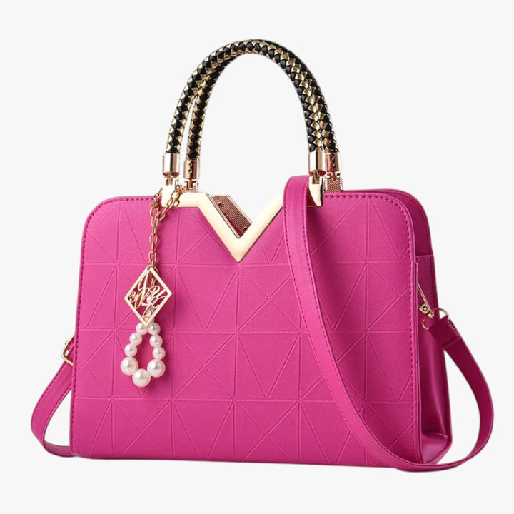 Accessorio moda donna: borsa a mano elegante, manici gioiello, per un'eleganza senza tempo.