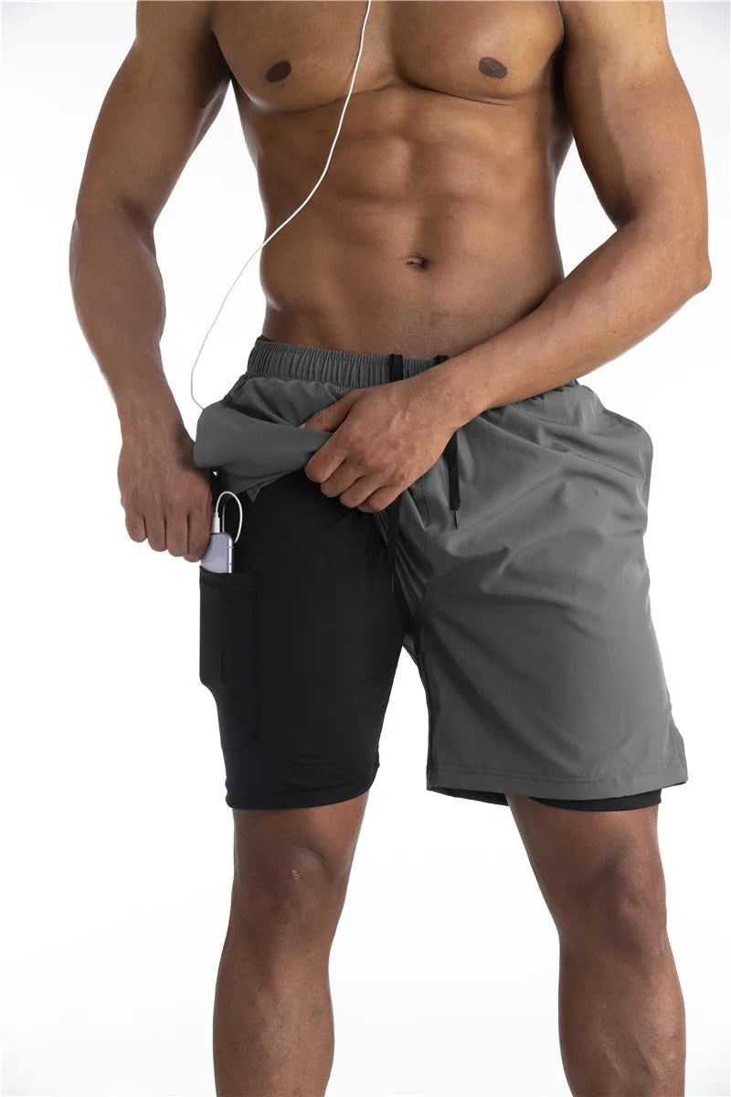 Pantaloncini uomo per allenamento, corsa e fitness. Abbigliamento sportivo premium con tasca telefono sicura.