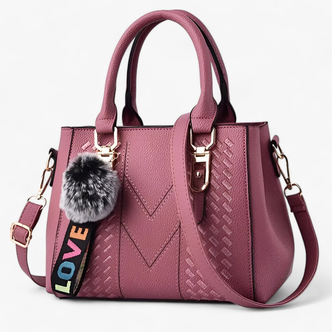 Borsa donna portabile a mano o a tracolla, con pompon decorativo, perfetta per ogni occasione.