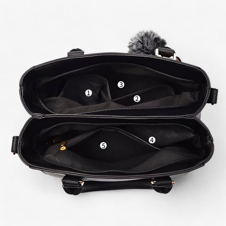 Borsa a mano donna con pompon fashion e tracolla, dettaglio chic per uno stile unico.