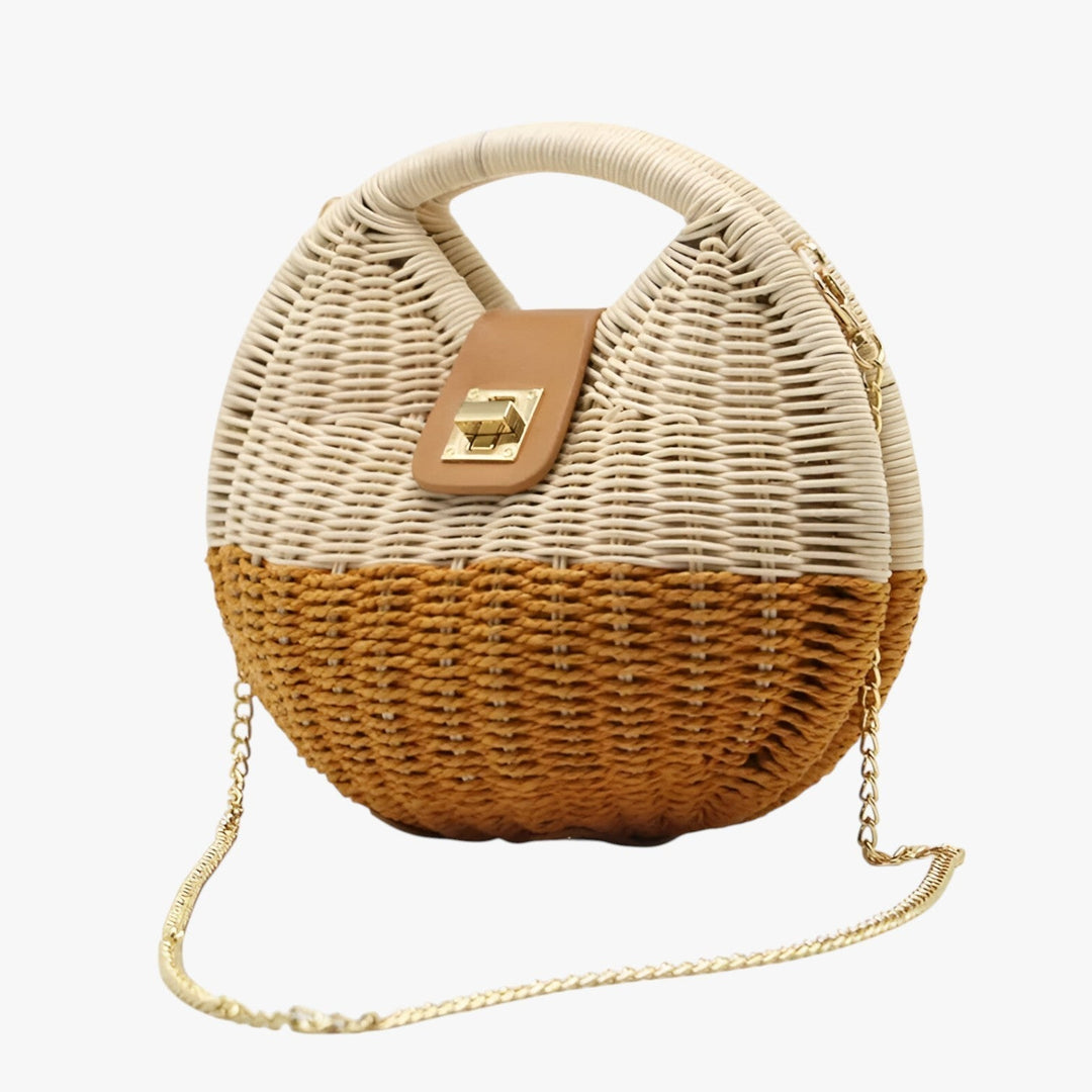 Borsa rotonda in paglia da donna con tracolla a catena, perfetta per l'estate e la spiaggia.