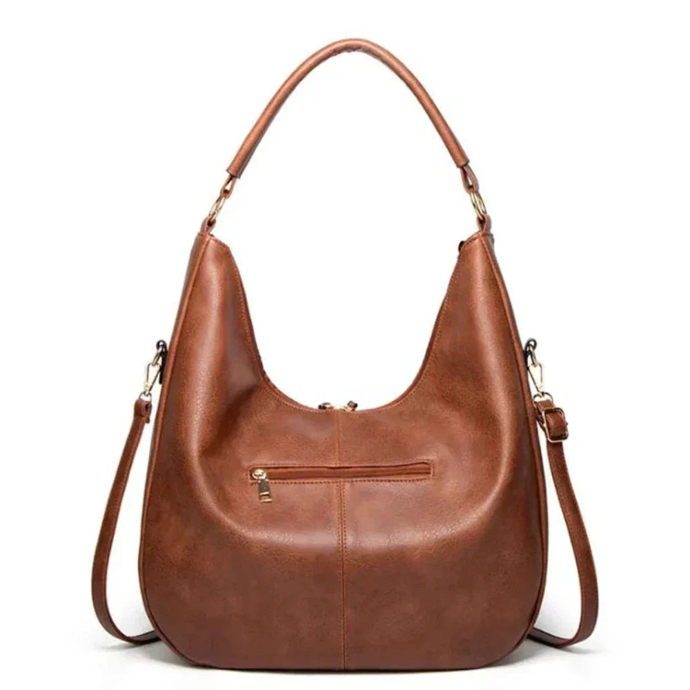 Borsa moda donna a tracolla in pelle vegana e velluto a coste, con nappine, un accessorio indispensabile.