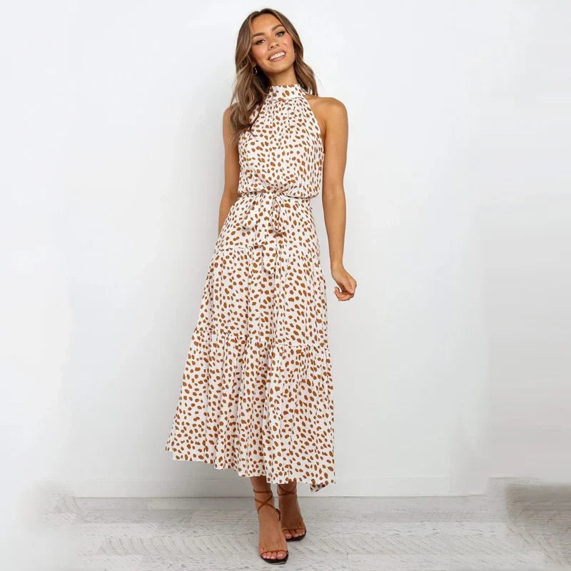 Abito lungo estivo donna blu con scollo annodato, vestito fluido senza maniche, perfetto per la moda boho chic.