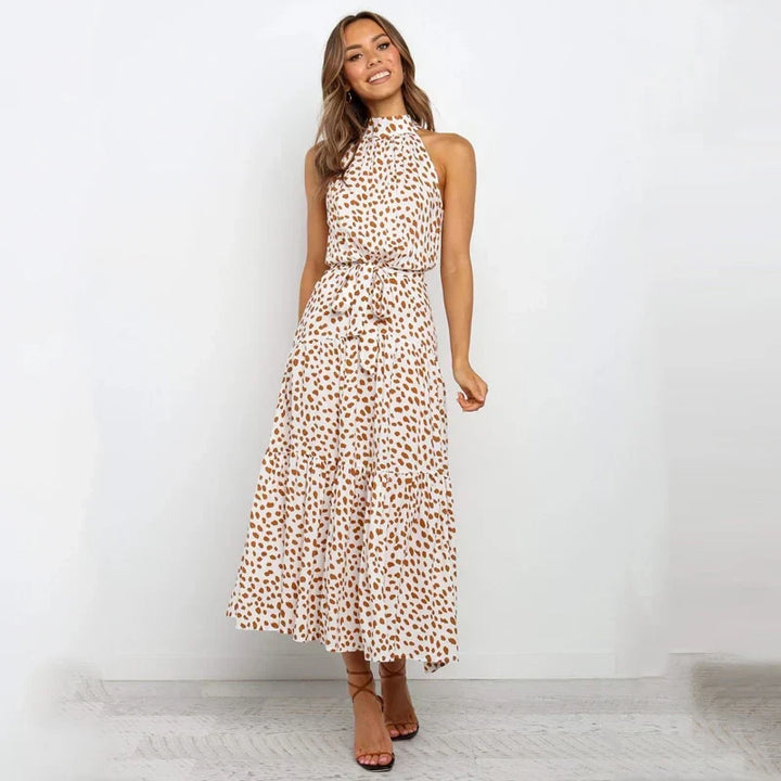 Abito lungo estivo donna blu con scollo annodato, vestito fluido senza maniche, perfetto per la moda boho chic.