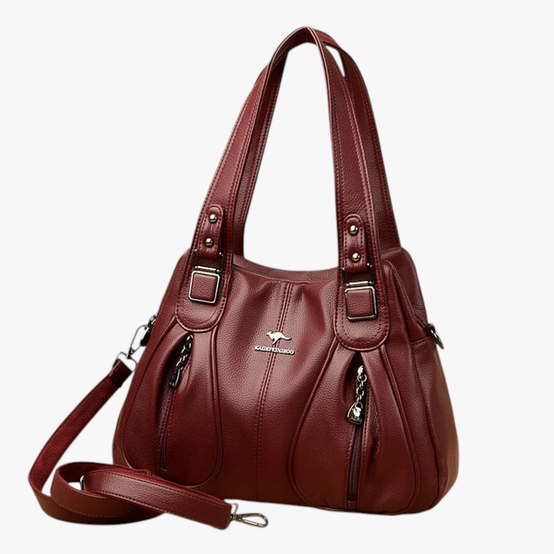 Borsa tote rossa, design versatile ed elegante, con scomparti multipli per organizzazione.