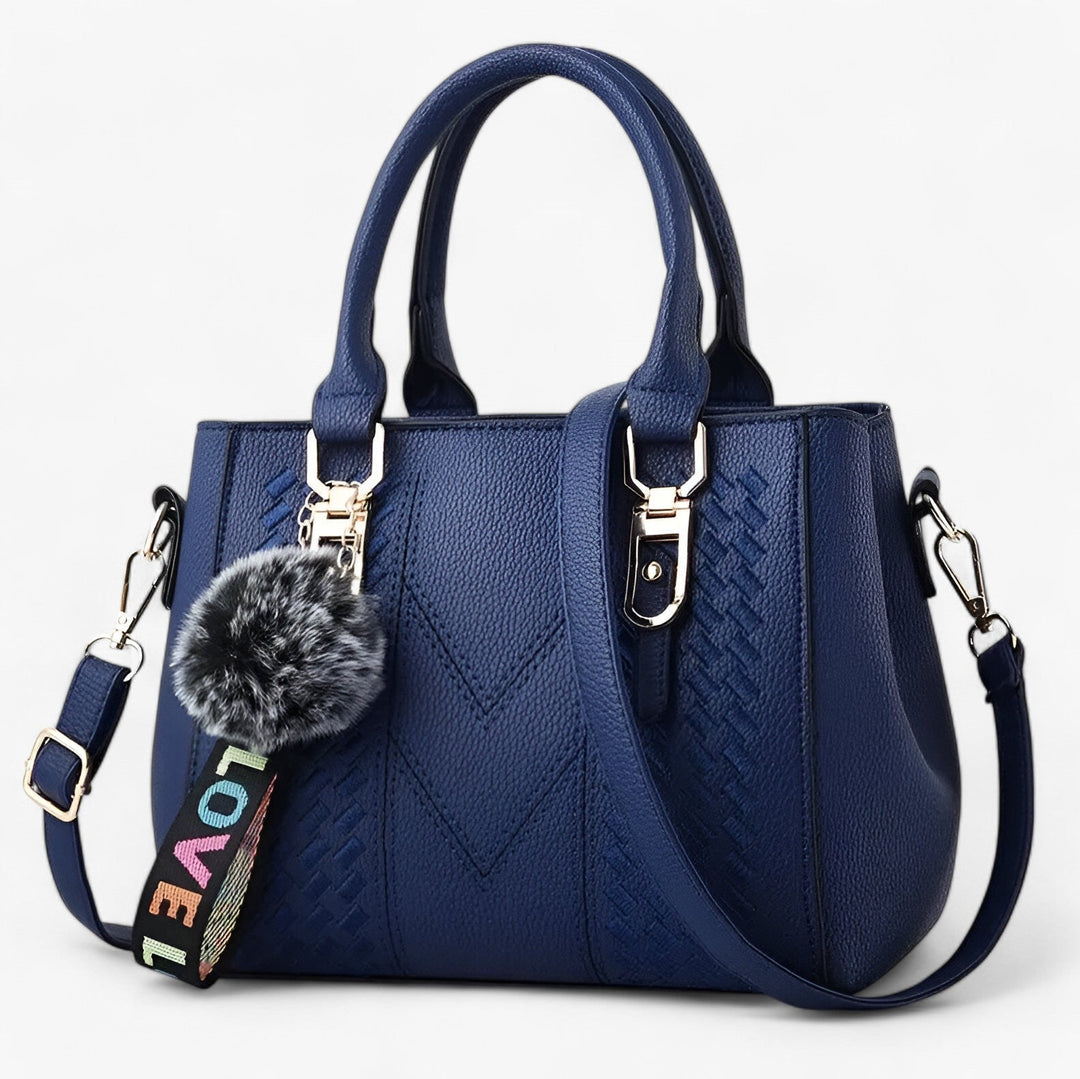 Borsa donna alla moda, elegante con pompon e tracolla, un accessorio indispensabile.