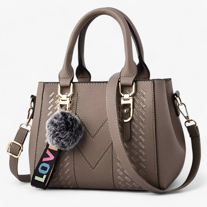 Esclusiva borsa donna elegante in pelle PU, con tracolla e pompon, un regalo perfetto.