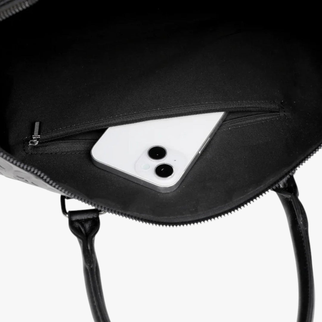 Borsone da viaggio donna nero con teschio, design unico. Borsa capiente ed elegante per weekend chic.