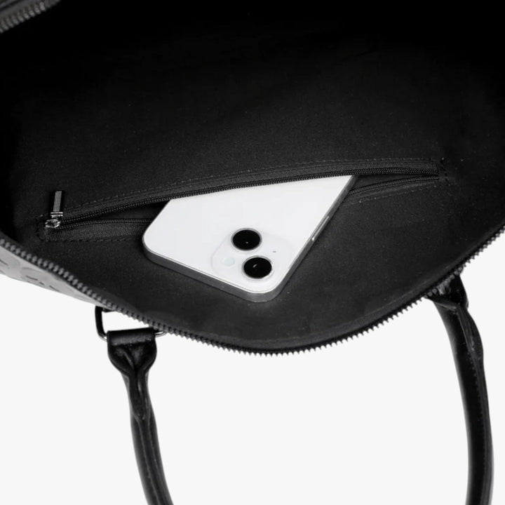 Borsone da viaggio donna nero con teschio, design unico. Borsa capiente ed elegante per weekend chic.