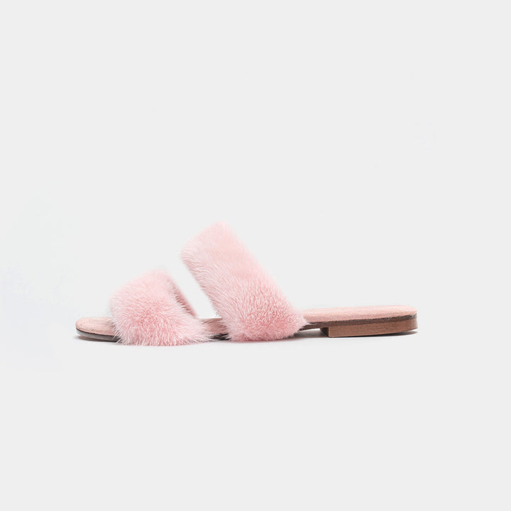 Eleganti pantofole rosa da donna con suola bassa, perfette per la casa e un tocco di moda.