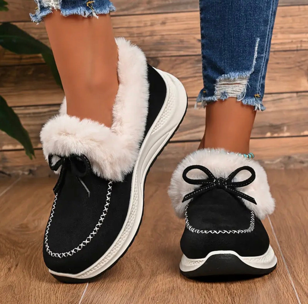 Sneakers invernali donna slip-on calde con fiocco, ideali per comfort e stile casual quotidiano.