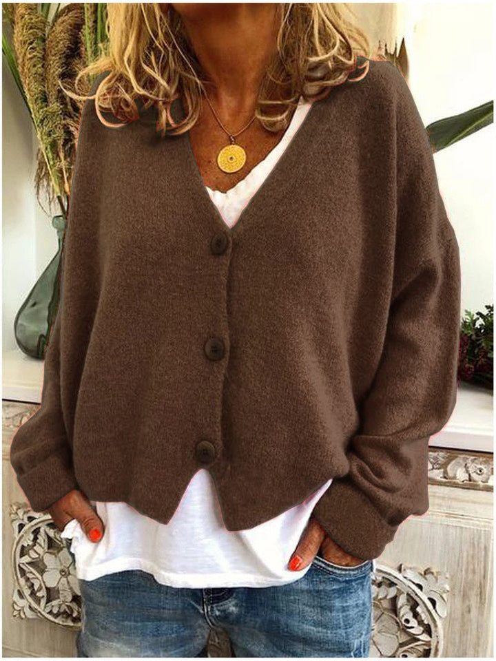 Cardigan donna in maglia, lungo ed elegante. Perfetto per l'ufficio e per un abbigliamento casual chic quotidiano.