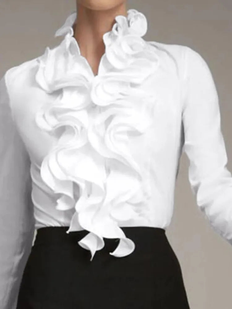 Moderna camicetta donna con volant e maniche lunghe, ideale per un outfit versatile e alla moda, giorno e sera.