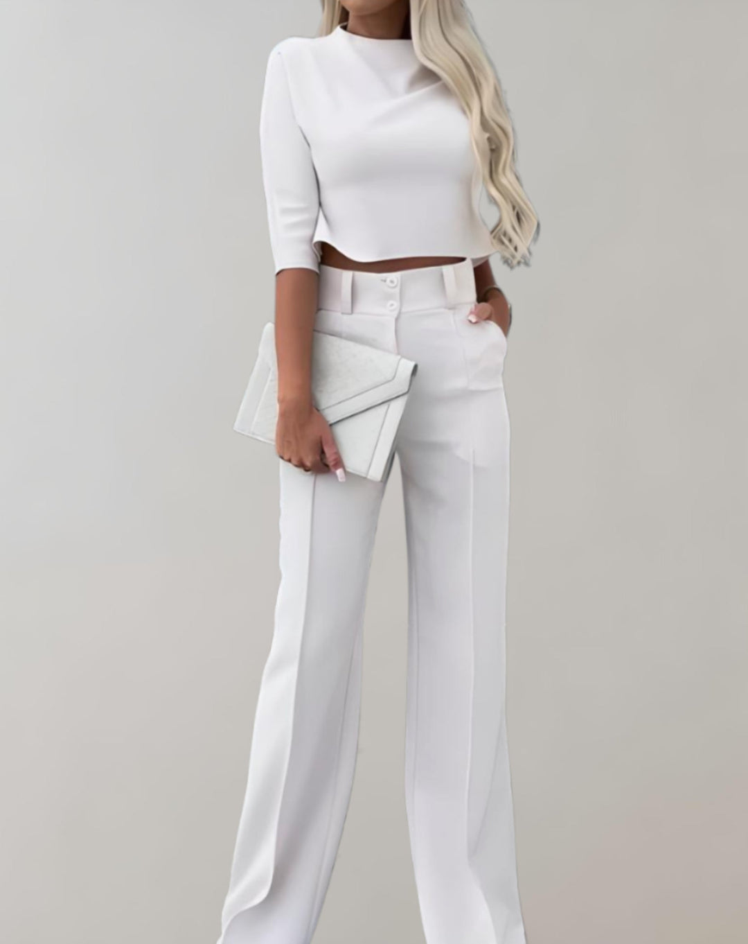 Completo donna due pezzi moda femminile. Pantaloni a gamba larga e top 3/4 per un look elegante o casual.